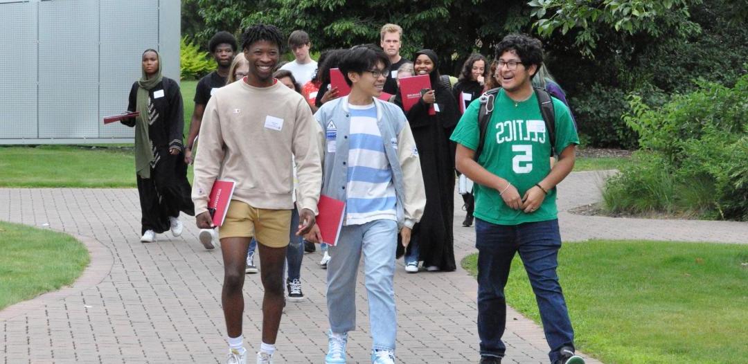 SOAR students (incoming freshmen) walking on campus at Hamline
